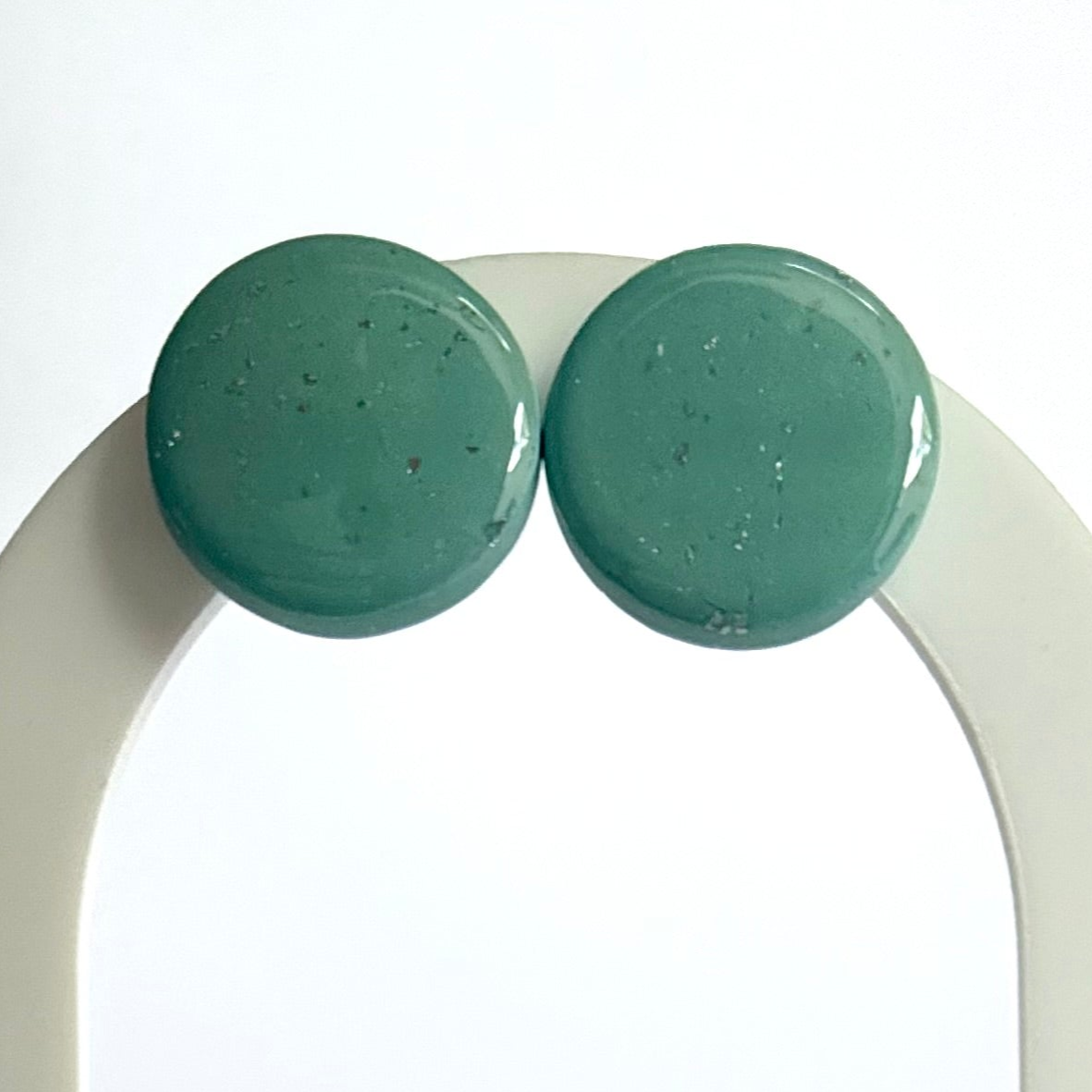 Jazzed statement studs with silver leaf accent